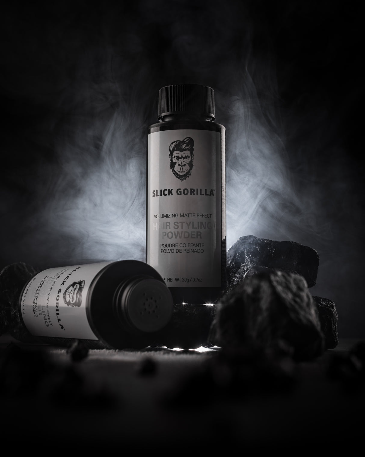 Slick Gorilla hair styling powders black backround with rocks