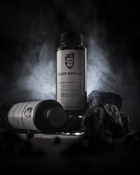 Slick Gorilla hair styling powders black backround with rocks
