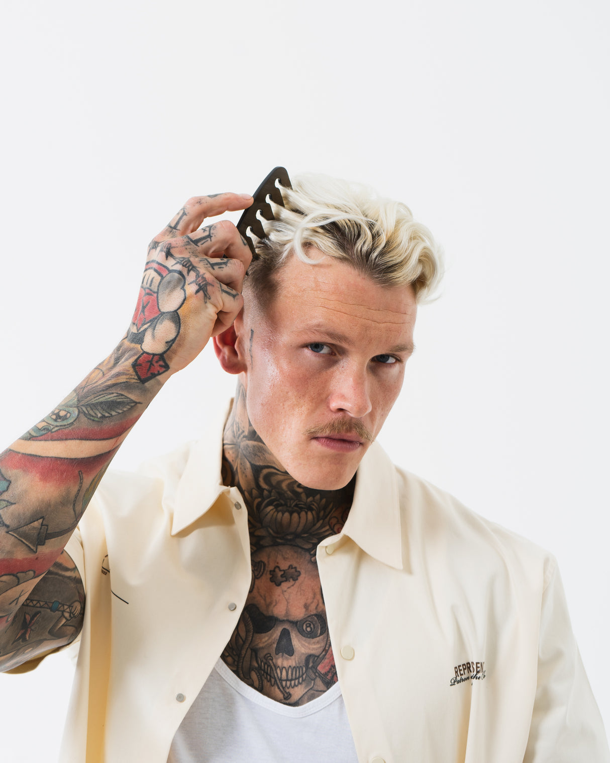 Slick Gorilla Texture Comb a man combing his hair