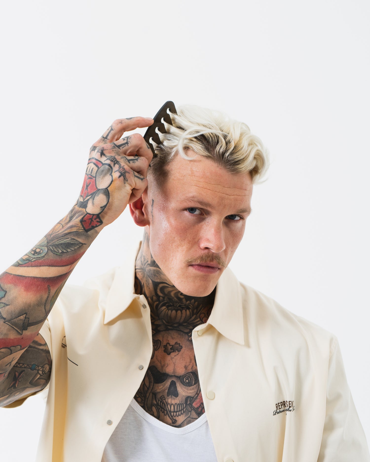 Slick Gorilla Texture Comb a man combing his hair